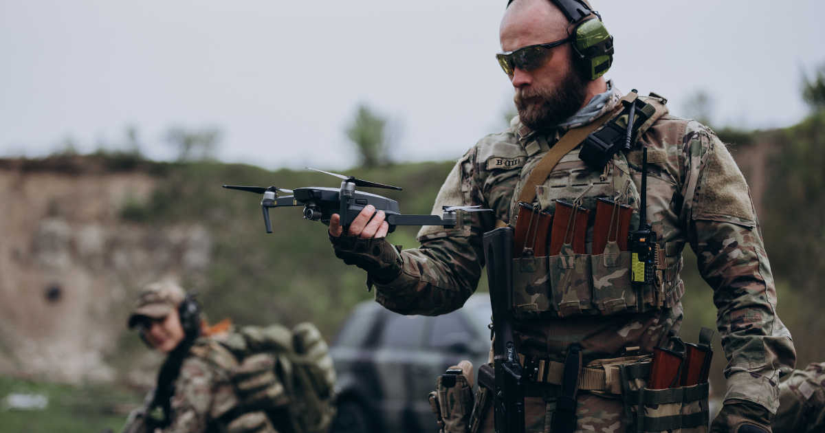 Uniformed Military Officer holding a drone or UAV