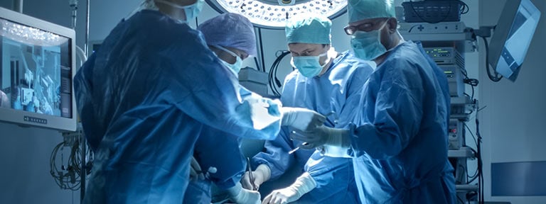 Group of surgeons in an operating roomo