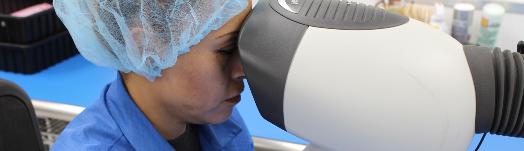 woman looking into machine